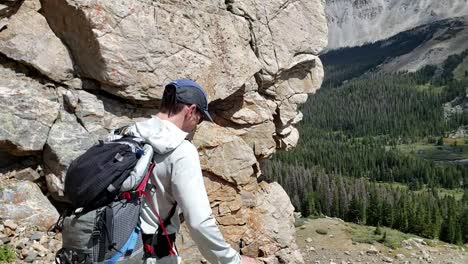 guy in shoes running down scree in colorado