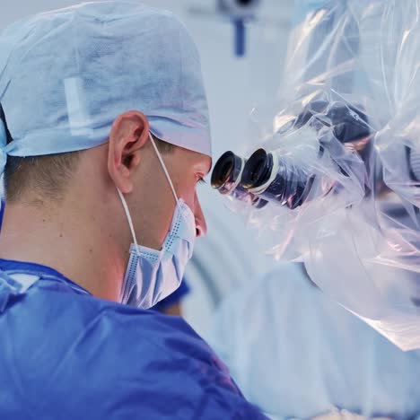 doctor's face and medical microscope. profile of professional neurosurgeon in mask looking into the microscope. neurosurgery concept. close-up.