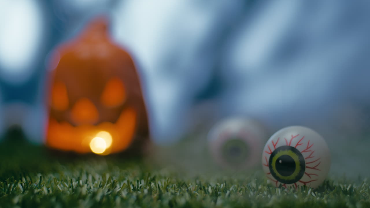 Horror eye with halloween pumpkin in the background
