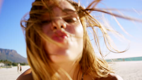 happy woman taking selfie on beach