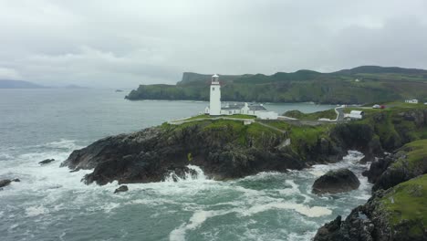 Aerial-view,-low-pan-left,-4K,-Fanad-Head-Lighthouse,-located-in-the-north-coast-of-Ireland