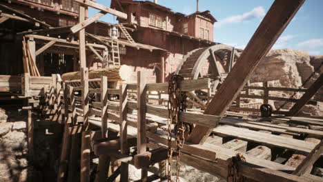 an abandoned wooden bridge leading to a rustic mill