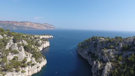 drone view flying over the mediterranean sea, getting out of a creek. sunny day