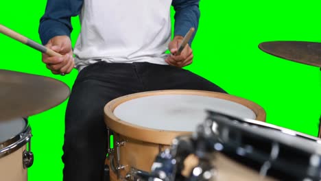 male drumer playing drum