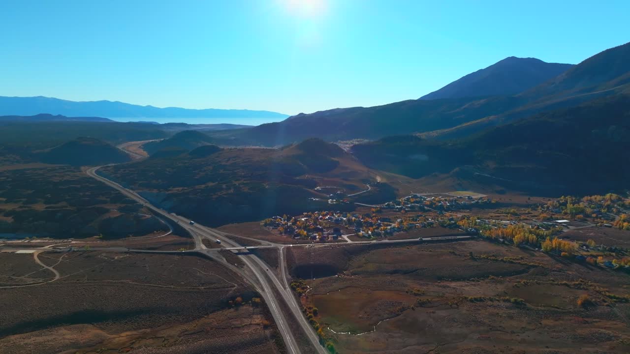 October Fall autumn Bishop Toms Place Sierra Mountains Lake Crowley highway road to Mammoth Lakes Mountain California aerial drone Minarets morning blue sky Whitmore Hilltop Hotsprings forward motion