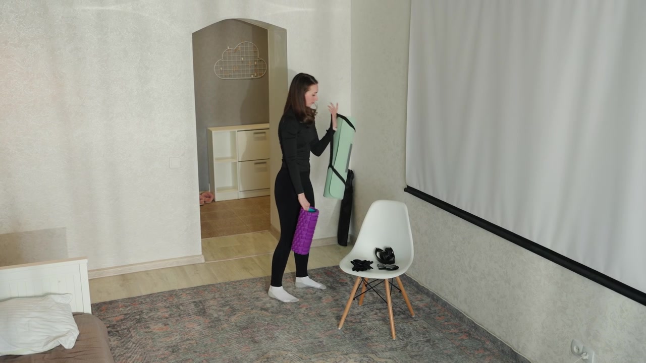 She swiftly organizes her workout items before departure. Woman quickly gathers her exercise gear and leaves promptly. She efficiently arranges her fitness equipment and departs in timely manner