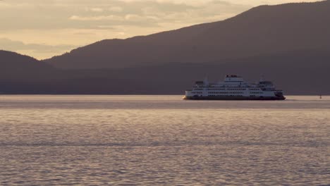 boat traveling near coast in washington, usa - wide shot