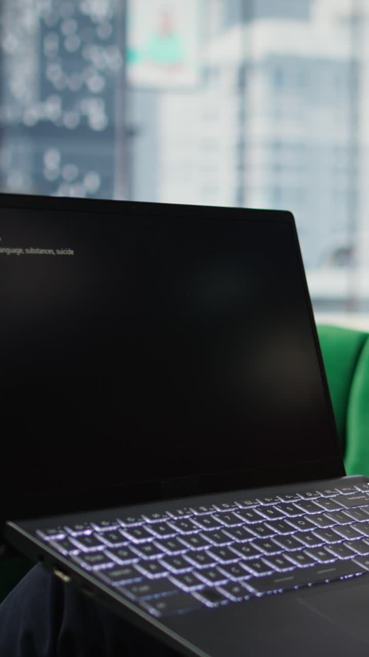 Vertical Video Bucharest, Romania - July 30th 2024 - Young CEO using Netflix to relax in office