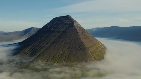 Pyramid Mountain Emerging from Clouds