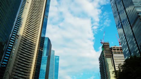 Time-lapse-of-clouds-over-skyscraper