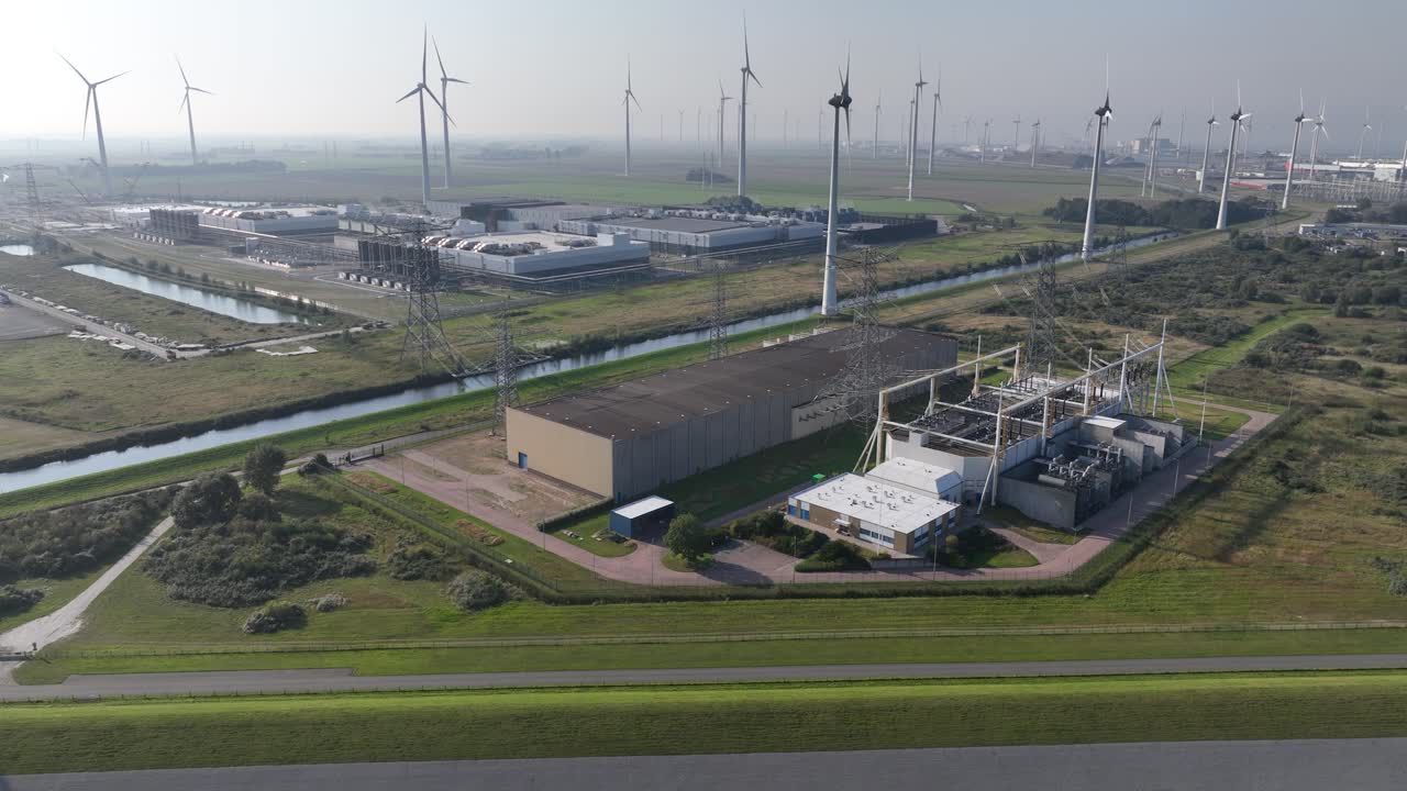 high voltage station infrastructure in The Eemshaven, The Netherlands. Aerial drone view.