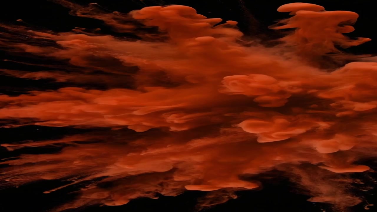 Explosion of Red Powder Against a Black Background