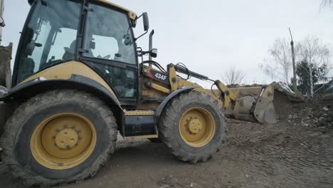 bulldozer, earth-moving equipment. land clearing, grading, pool excavation, utility trenching, utility trenching and foundation digging during of large construction jobs.