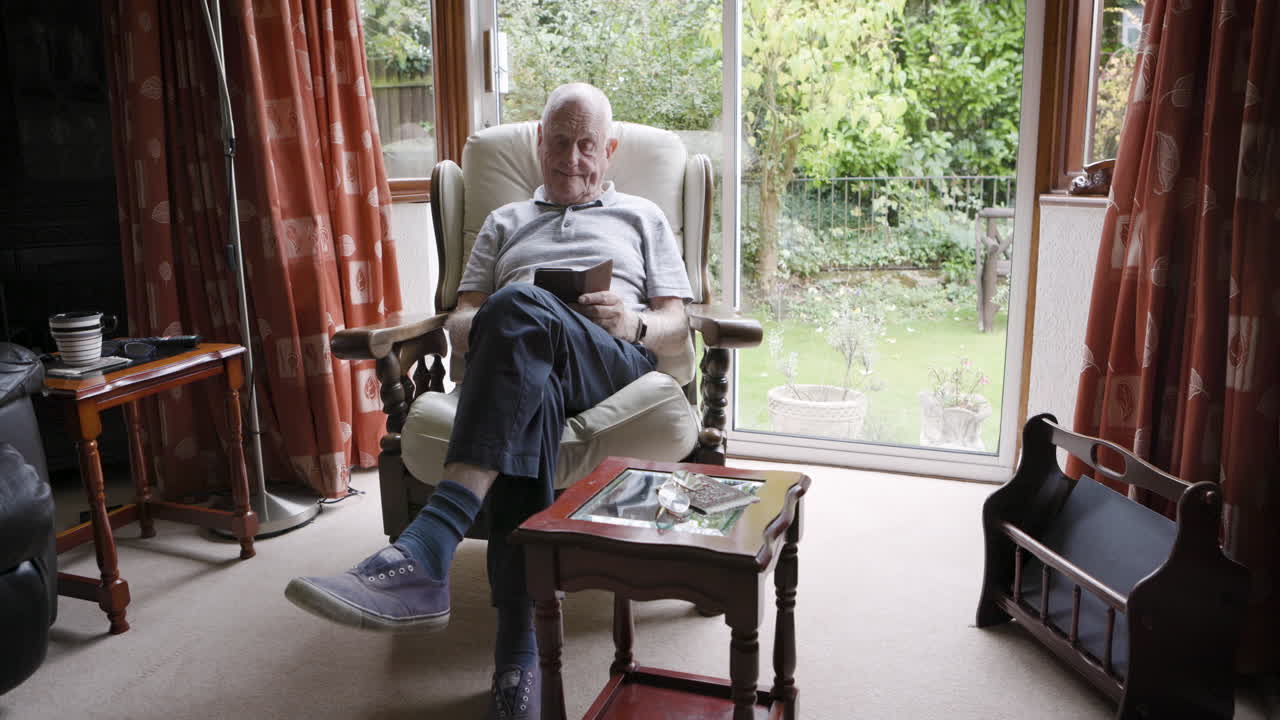 Man Reading in Armchair