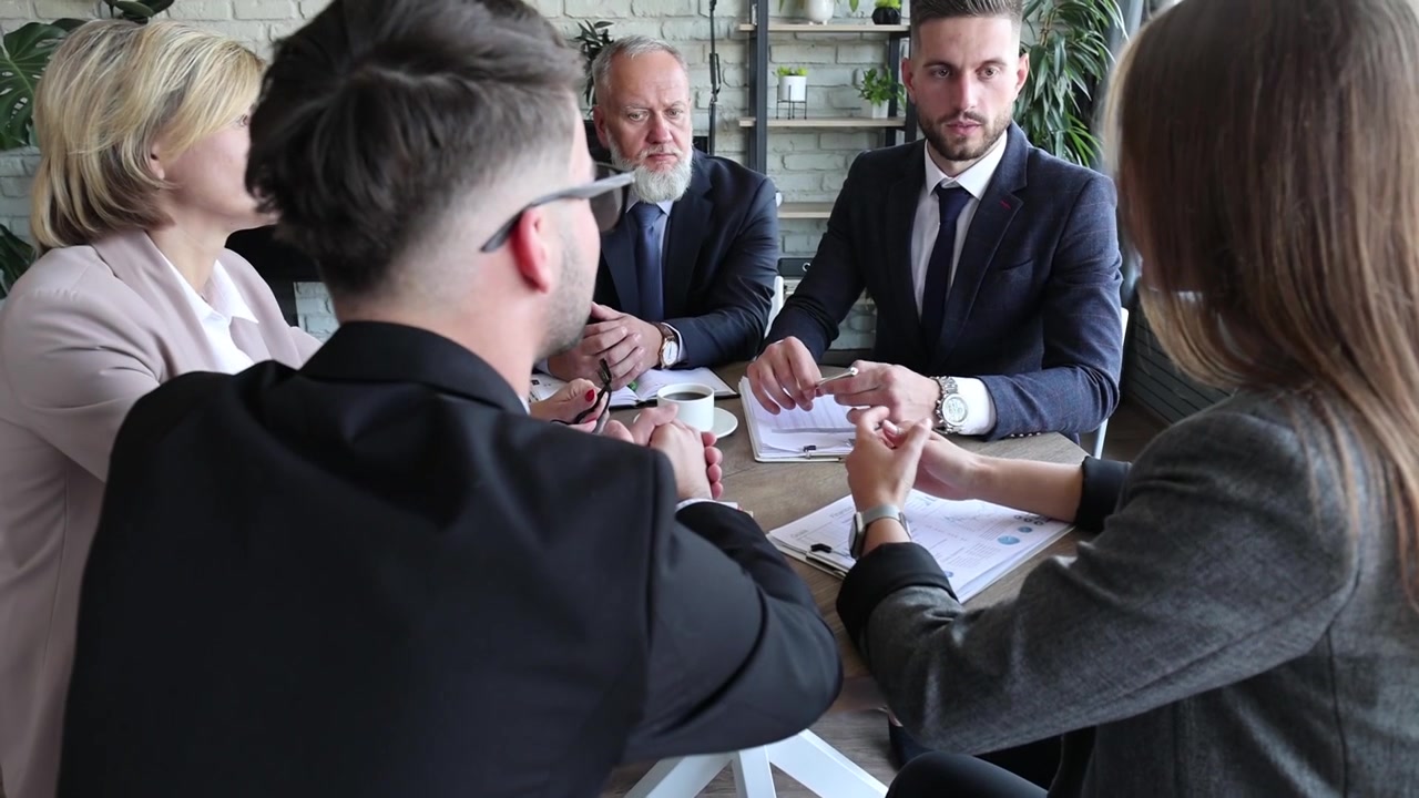 Diverse Business Team Discussing Strategy in a Modern Office Meeting