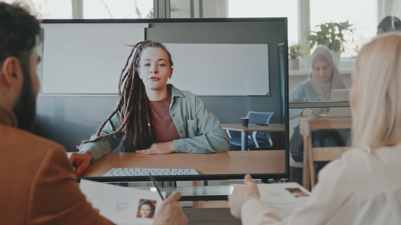 Managers Talking to Job Candidate on Video Call