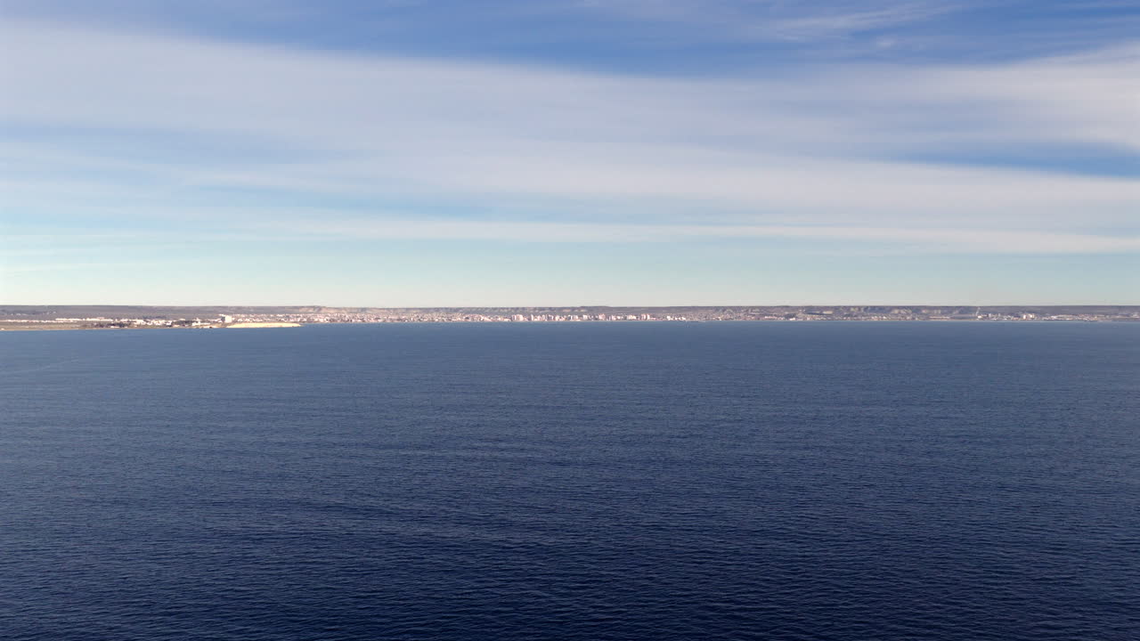Aerial view of Puerto Madryn cityscape along the Atlantic coast in Patagonia, Argentina, captured by drone