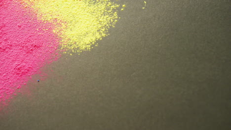 Video-of-multi-coloured-powders-with-copy-space-on-black-background