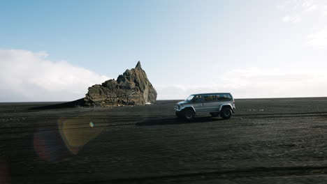 icelandic black sand beach with van