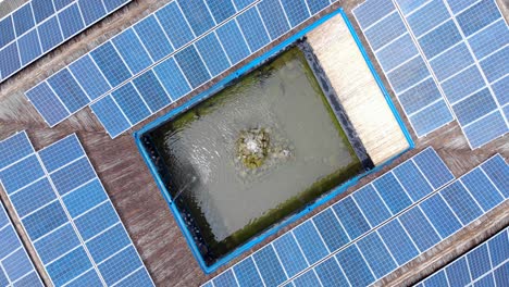 water fountain surrounded with solar panels at daytime