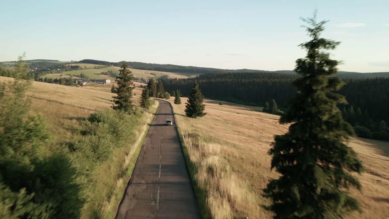 Aerial drone footage of a car driving along the Sihla pass road in Central Slovakia in late summer