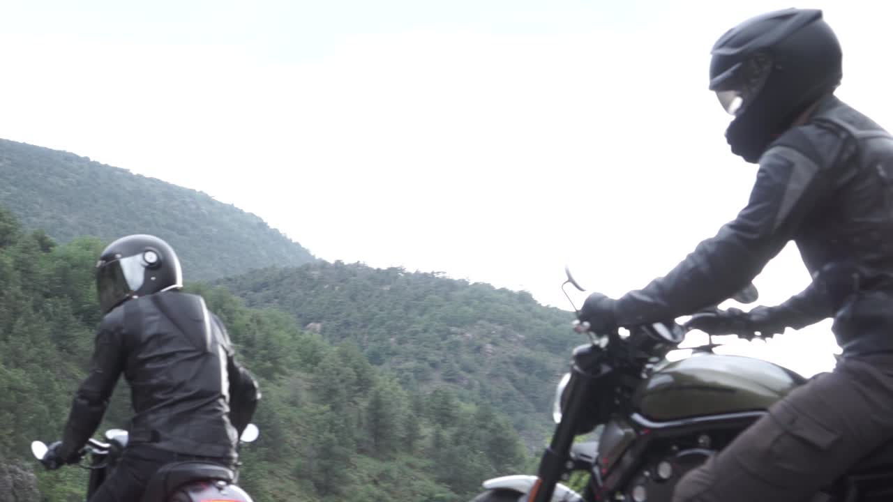 Motorcycle Riders on a Mountain Road