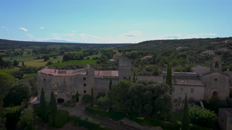 Aerial-orbiting-shot-of-the-remote-Chateau-Pouzihllac-near-Uzes,-France