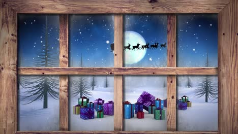 Wooden-window-frame-against-snow-falling-over-christmas-gifts-on-winter-landscape