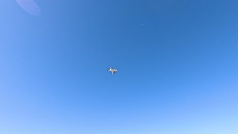 drone flying in clear blue sky