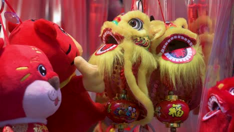 chinese new year decorative ornaments, such as yellow lions, seen for sale at a shop ahead of the lunar chinese new year in hong kong