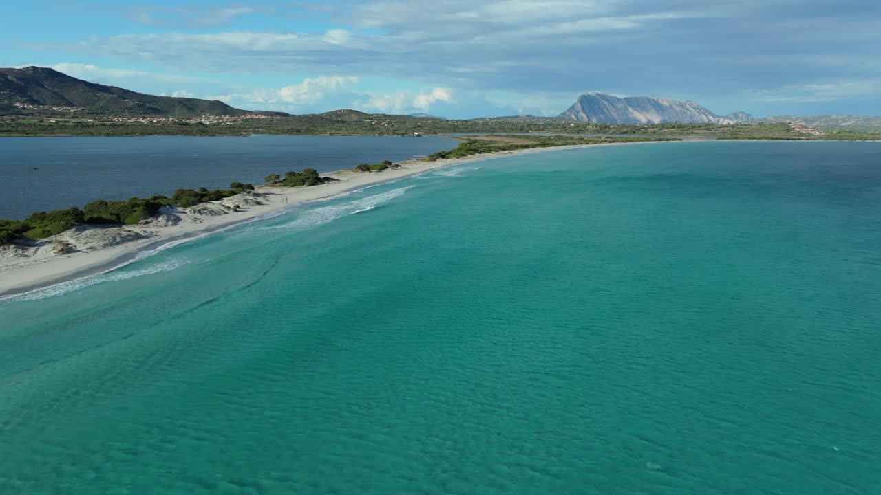 La cinta beach in sardinia, italy, offers stunning turquoise waters and white sand, a popular destination for summer holidays