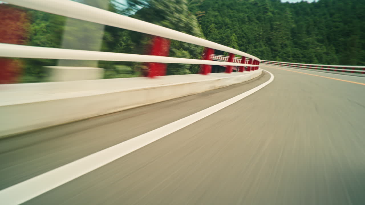 Road with Guardrail and Green Trees
