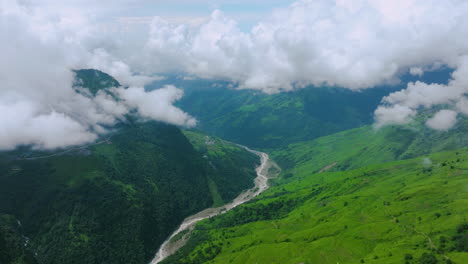 Cinematic-cloudy-green-landscapes-and-river-Drone-shot-in-Nepal