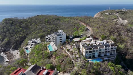 residences, hotels and dwellings nestled amidst mountainous terrain encircling bays of huatulco, oaxaca, mexico