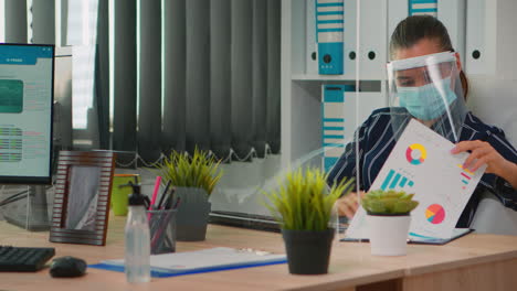 disabled businessman cleaning hands before typing