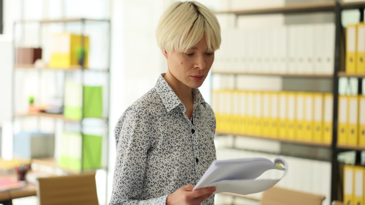 Woman reviewing documents in an office
