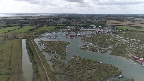 aerial pull back shot away from tollesbury marina