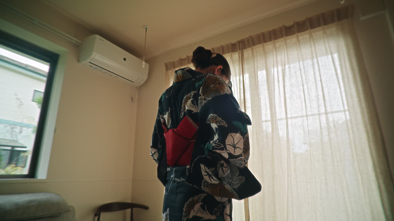 Woman in Kimono in a Room