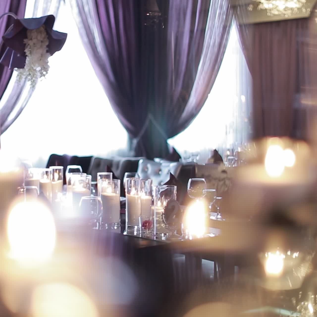 Decorative candles burning on a banquet table