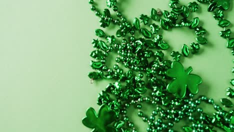 Video-of-st-patrick's-green-shamrock-and-necklace-on-green-background