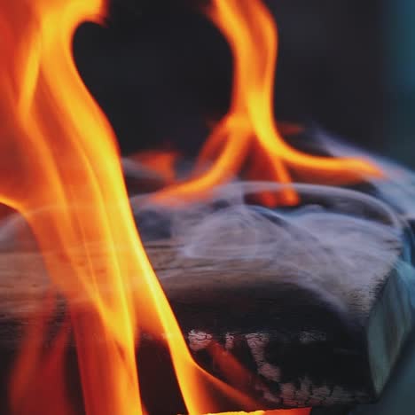 slow motion burning fire in a home fireplace. close-up