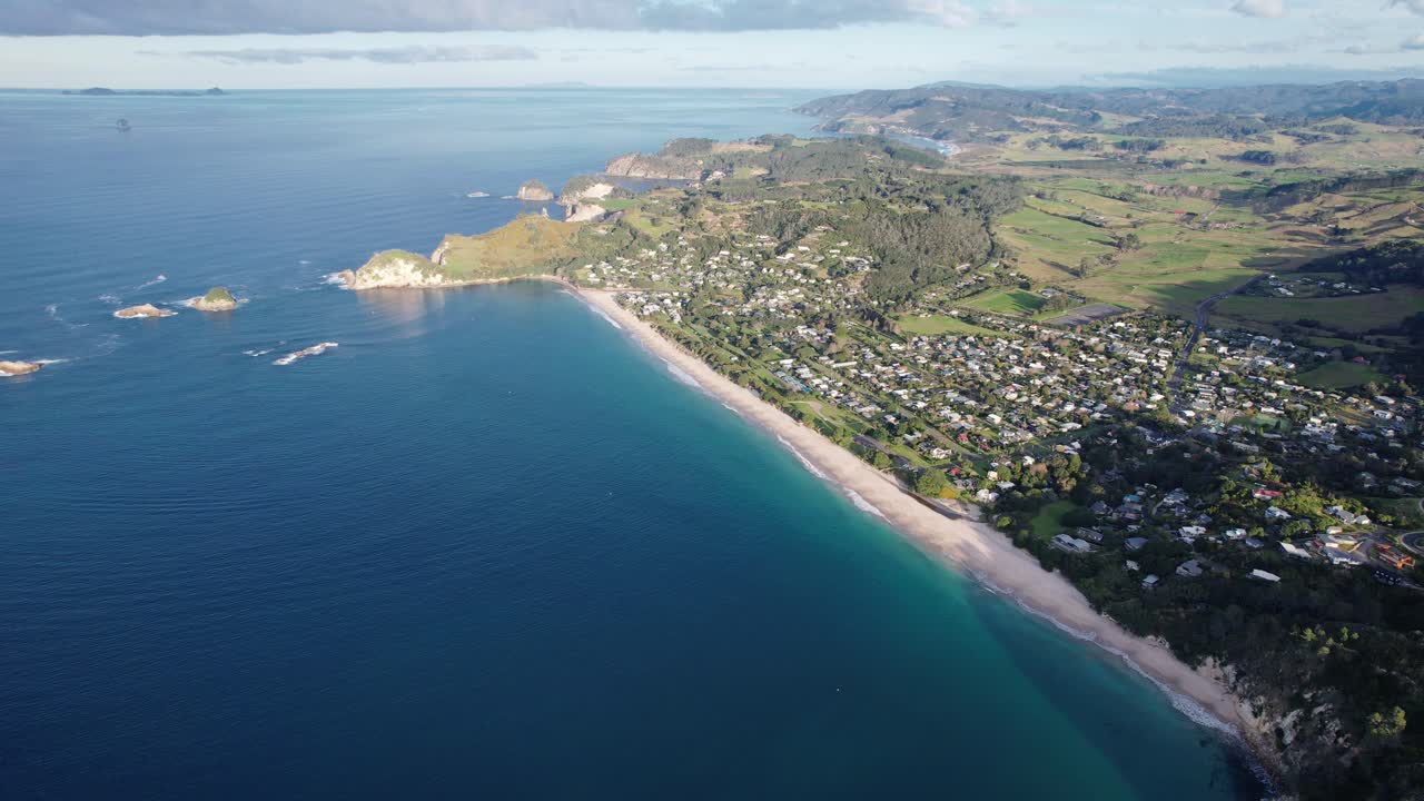 Breathtaking Aerial View of a Coastal Town and Beach