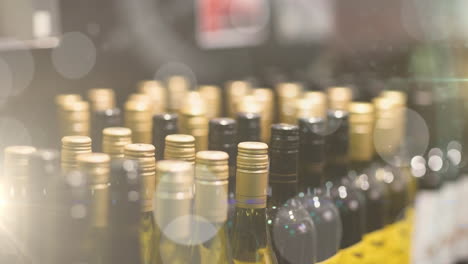 animation of bokeh over wine bottles at shop