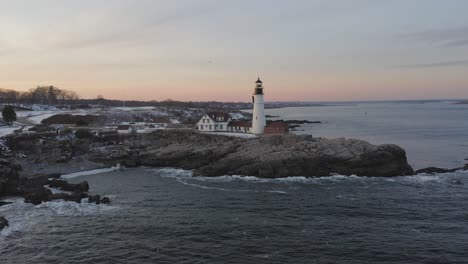 slow aerial orbit of cape elizabeth lighthouse during winter sunset