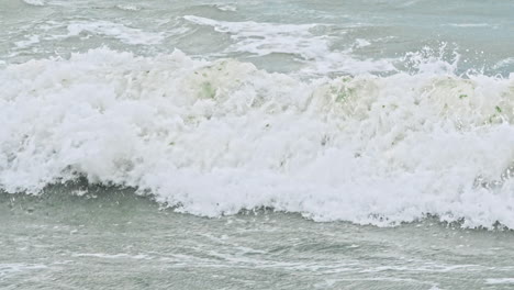 powerful waves crushing on a rocky beach