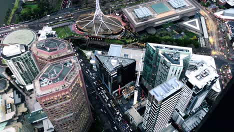 Melbourne-district-Southbank-where-the-Arts-Center-Melbourne-is-located,-seen-from-above-in-the-evening