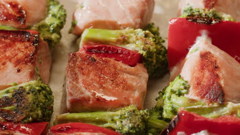 grilled salmon skewers with broccoli and red bell peppers