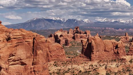 Aerial-view-of-massive-red-rock-formations-near-Moab,-Utah,-showcasing-the-majestic-and-desolate-desert-landscape