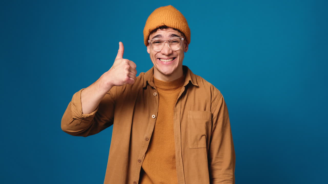 Man giving thumbs down with a sad expression