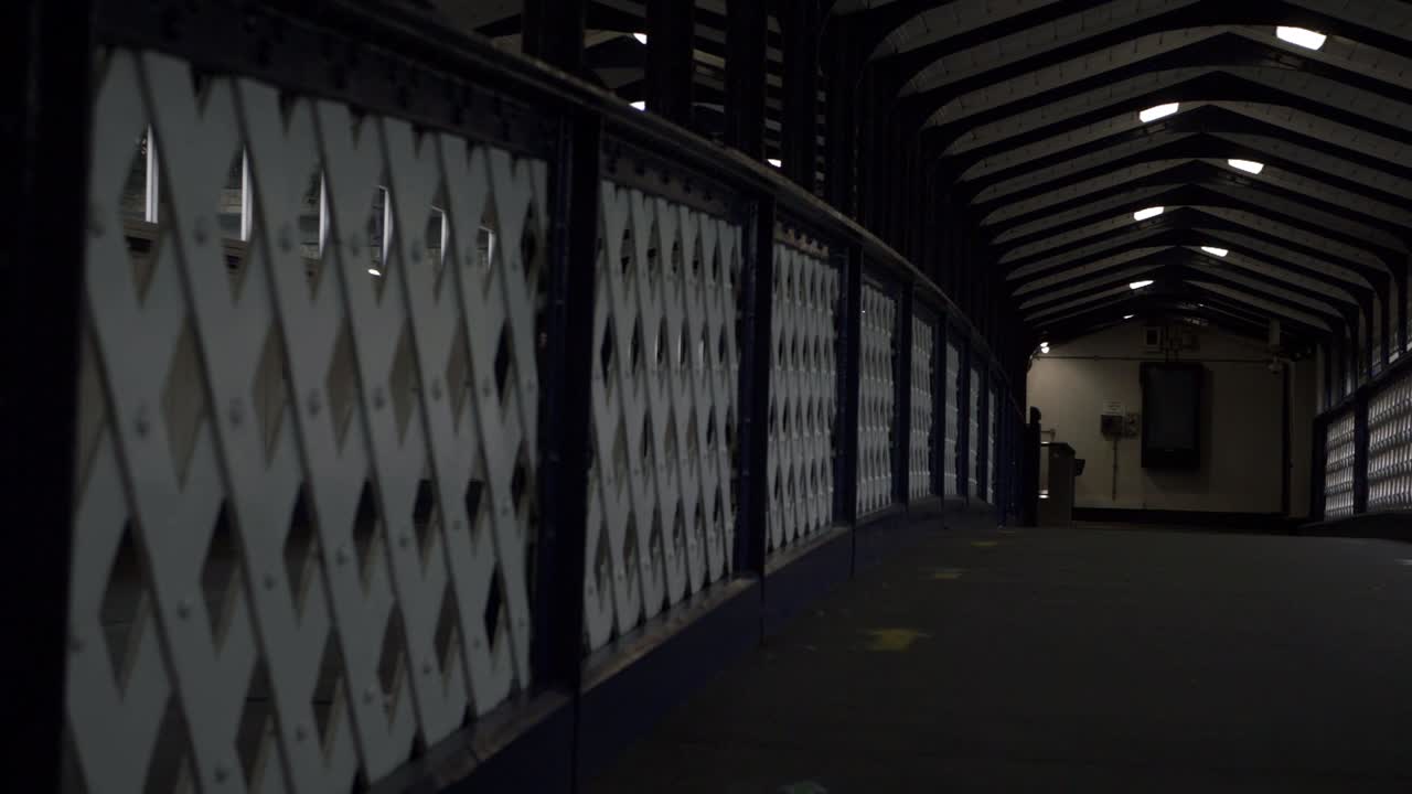 Walking along lonely empty railway bridge